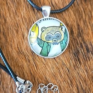 1970s Raccoon playing cymbals Richard Scarry book page necklace ooak upcycled